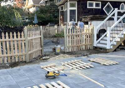 The Fence Guy installs a wooden picket fence
